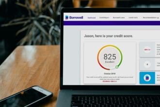 Illustration of a high credit score meter pointing to exceptional credit score range on a desk setu
