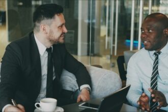 Professional discussing career growth and side income opportunities during a meeting.