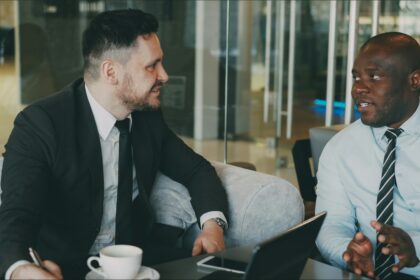 Professional discussing career growth and side income opportunities during a meeting.
