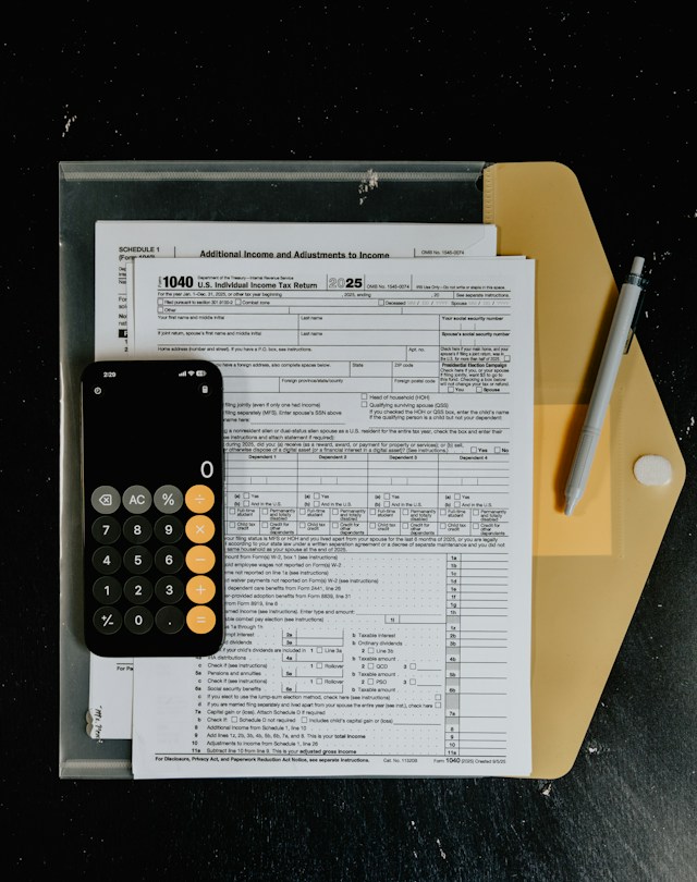 Notebook showing a zero based budgeting template calculation where income minus expenses equals zero balance