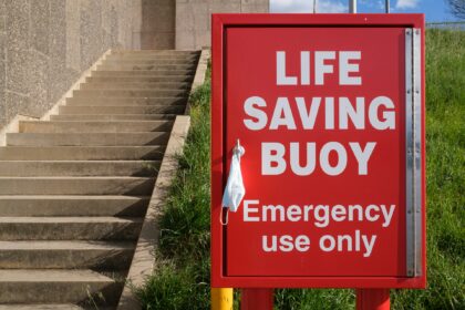Person organizing finances and building an emergency fund from scratch